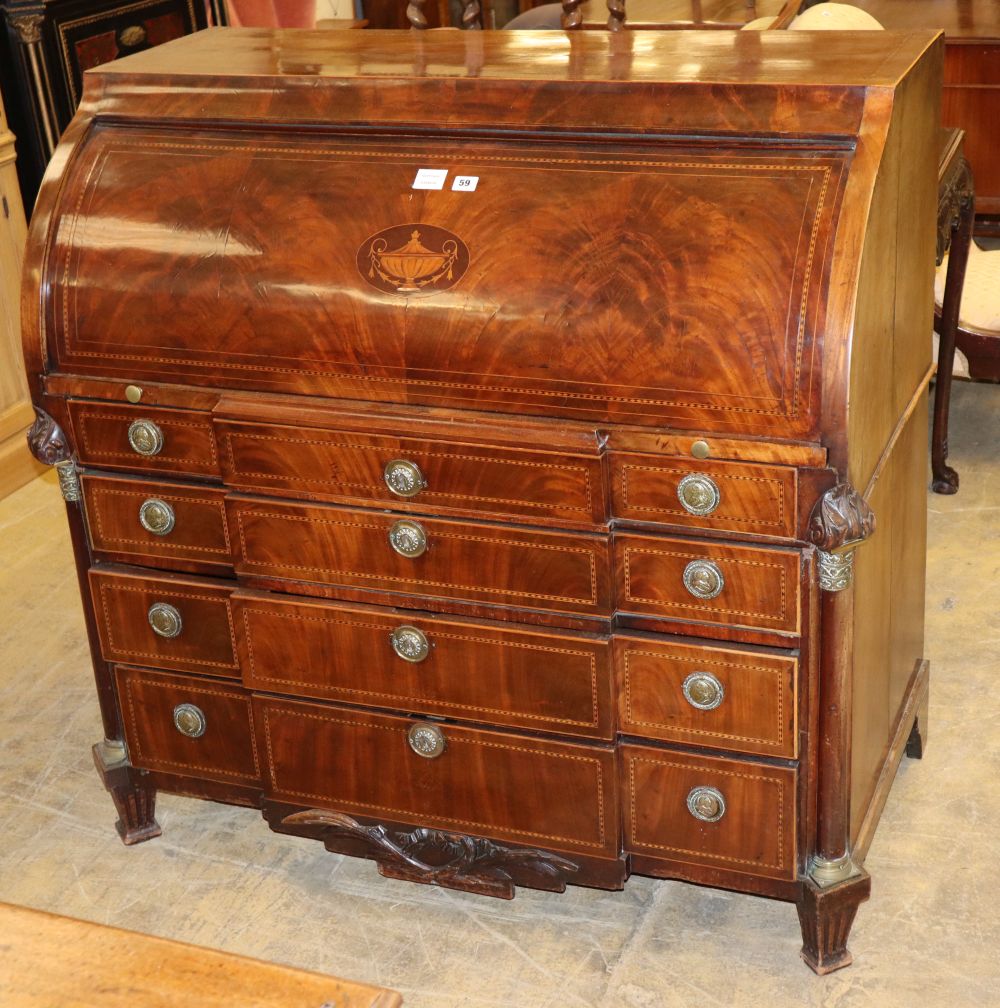An early 19th century Dutch mahogany and chequer inlaid cylinder breakfront bureau, with fitted interior and four long graduated drawer